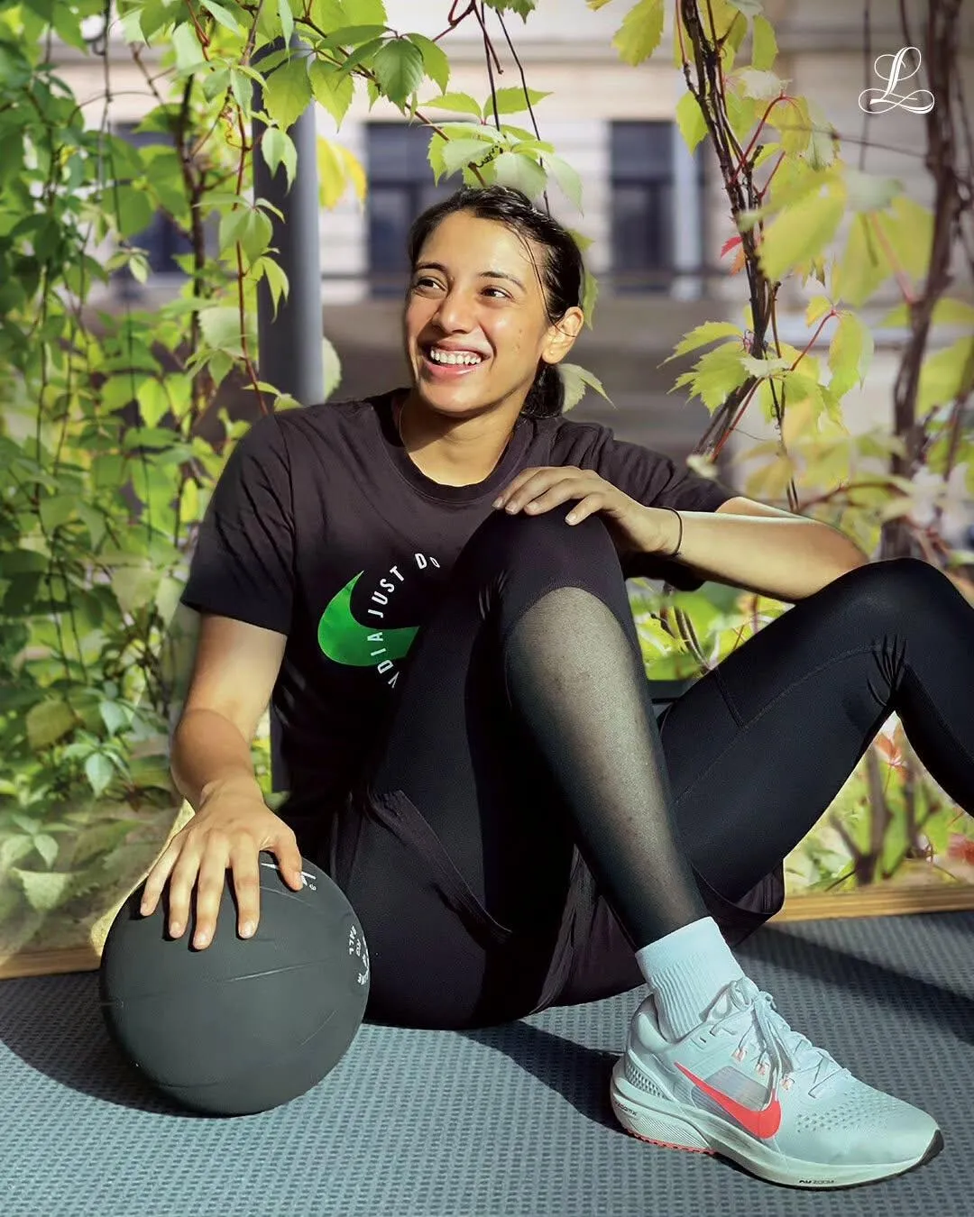Smriti Mandhana in a relaxed pose during downtime wallpaper