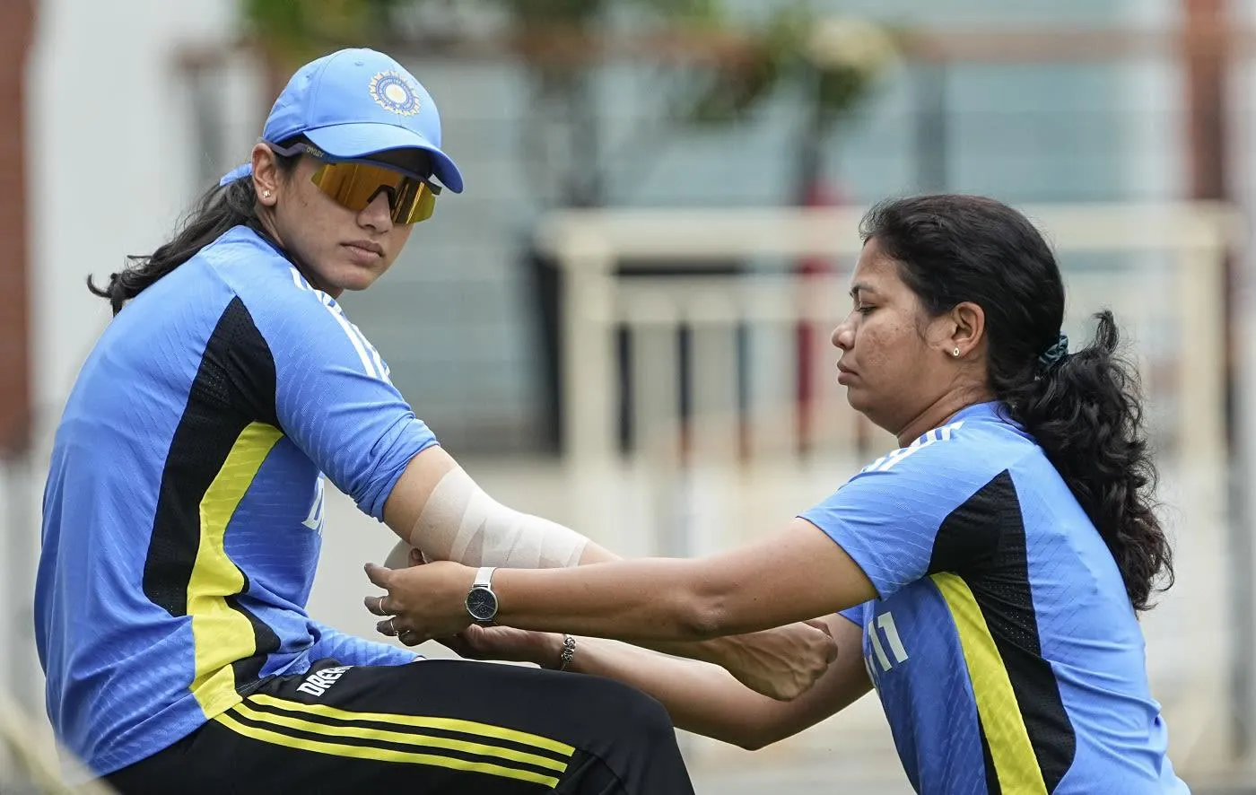 Smriti Mandhana in action with her teammates on the field