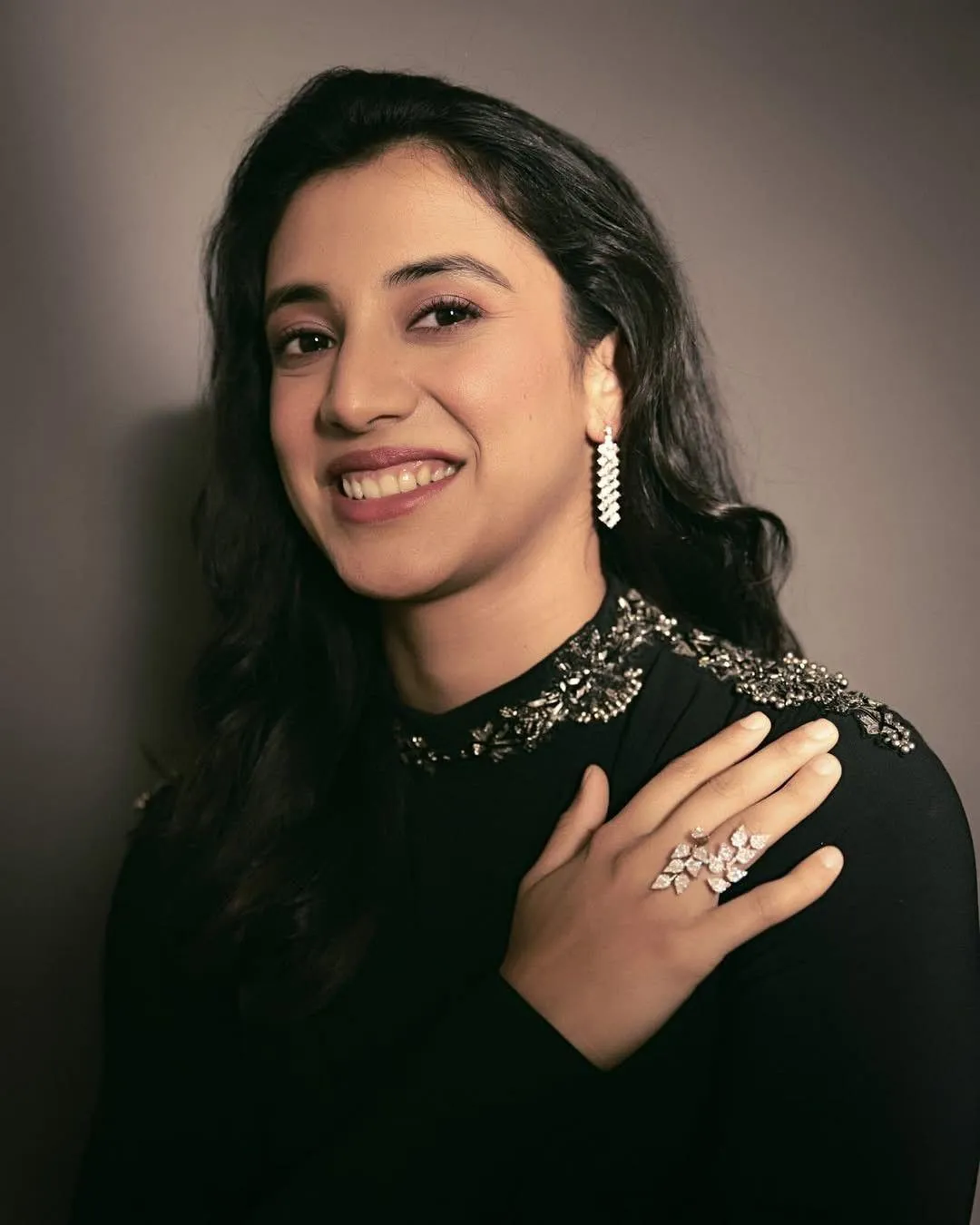 Smriti Mandhana in Black Outfit with Confident Smile Pose