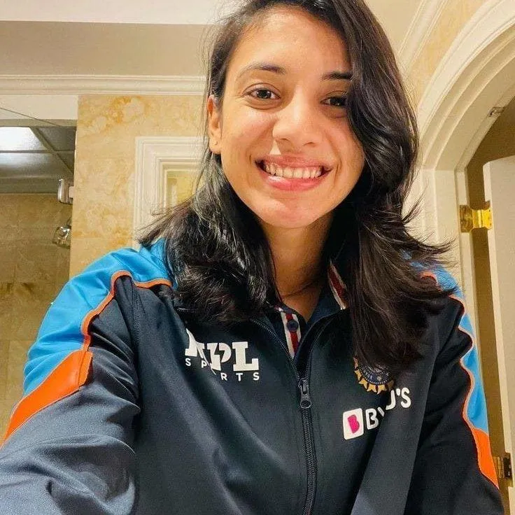Smriti Mandhana in casual attire smiling for a photo