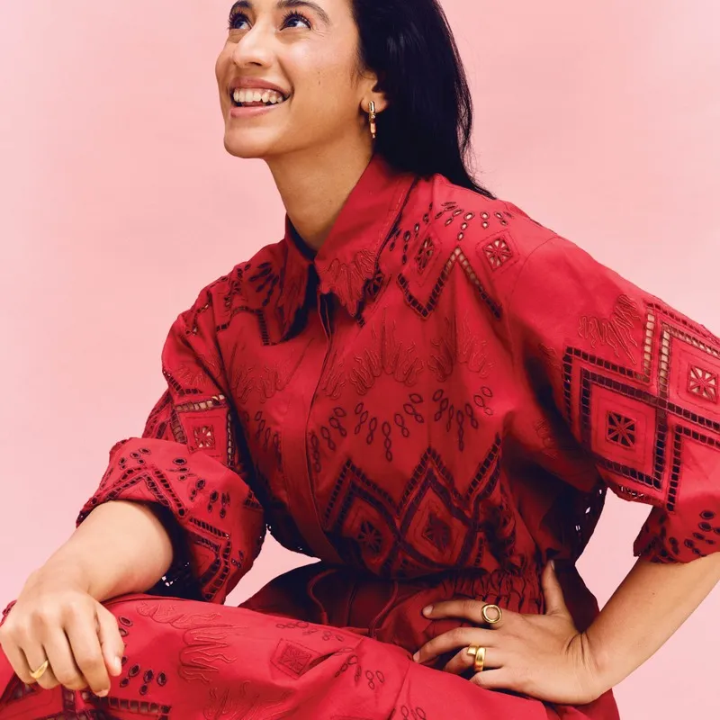 Smriti Mandhana in casual wear smiling at a photo shoot