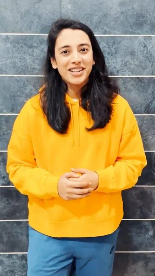 Smriti Mandhana in Casual Yellow Hoodie Outfit wallpaper