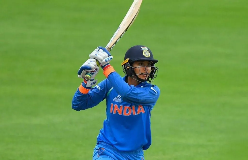 Smriti Mandhana in Cricket Stance on the Field wallpaper