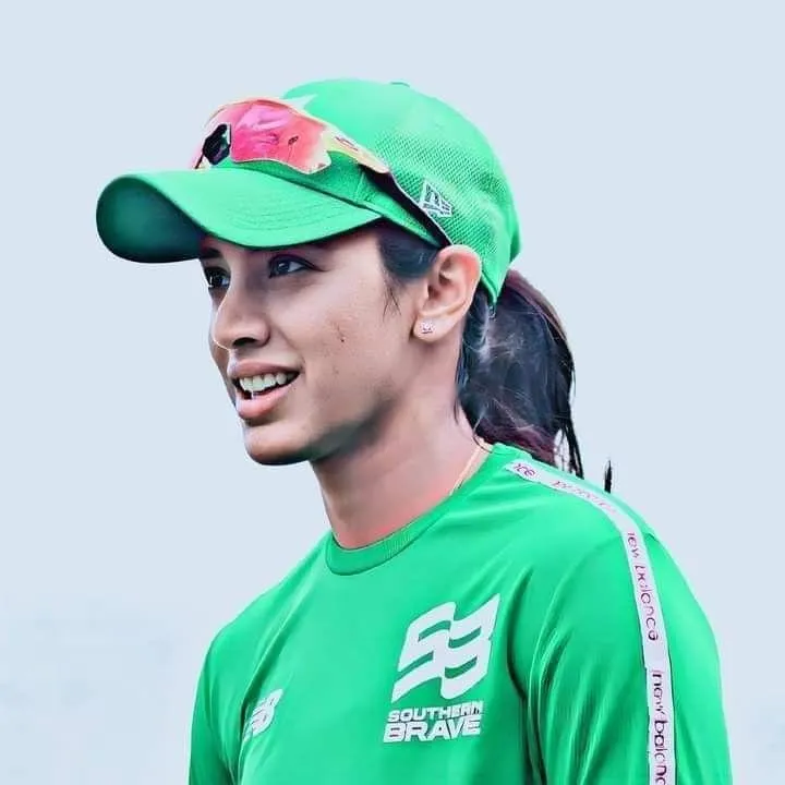 Smriti Mandhana in Green Jersey at a Cricket Event