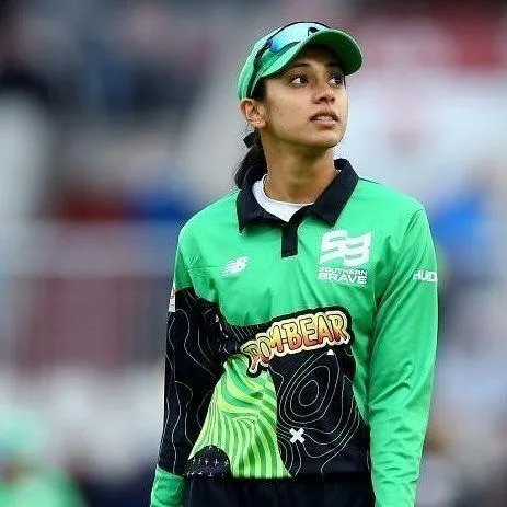 Smriti Mandhana in Green Jersey Playing Cricket wallpaper