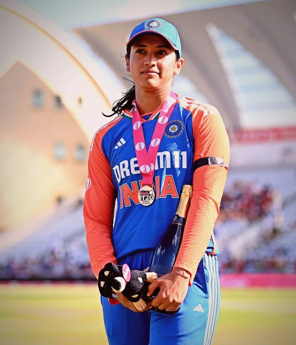 Smriti Mandhana in her blue cricket kit ready to play