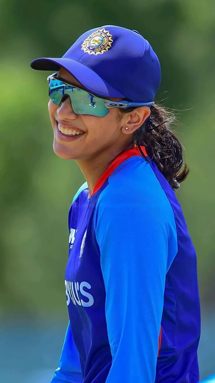 Smriti Mandhana in her cricket attire preparing for the match
