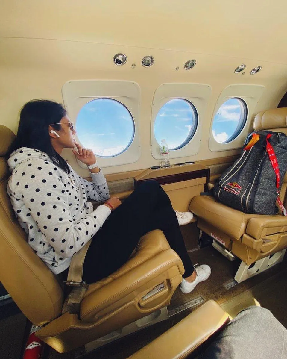 Smriti Mandhana in her seat enjoying a peaceful flight
