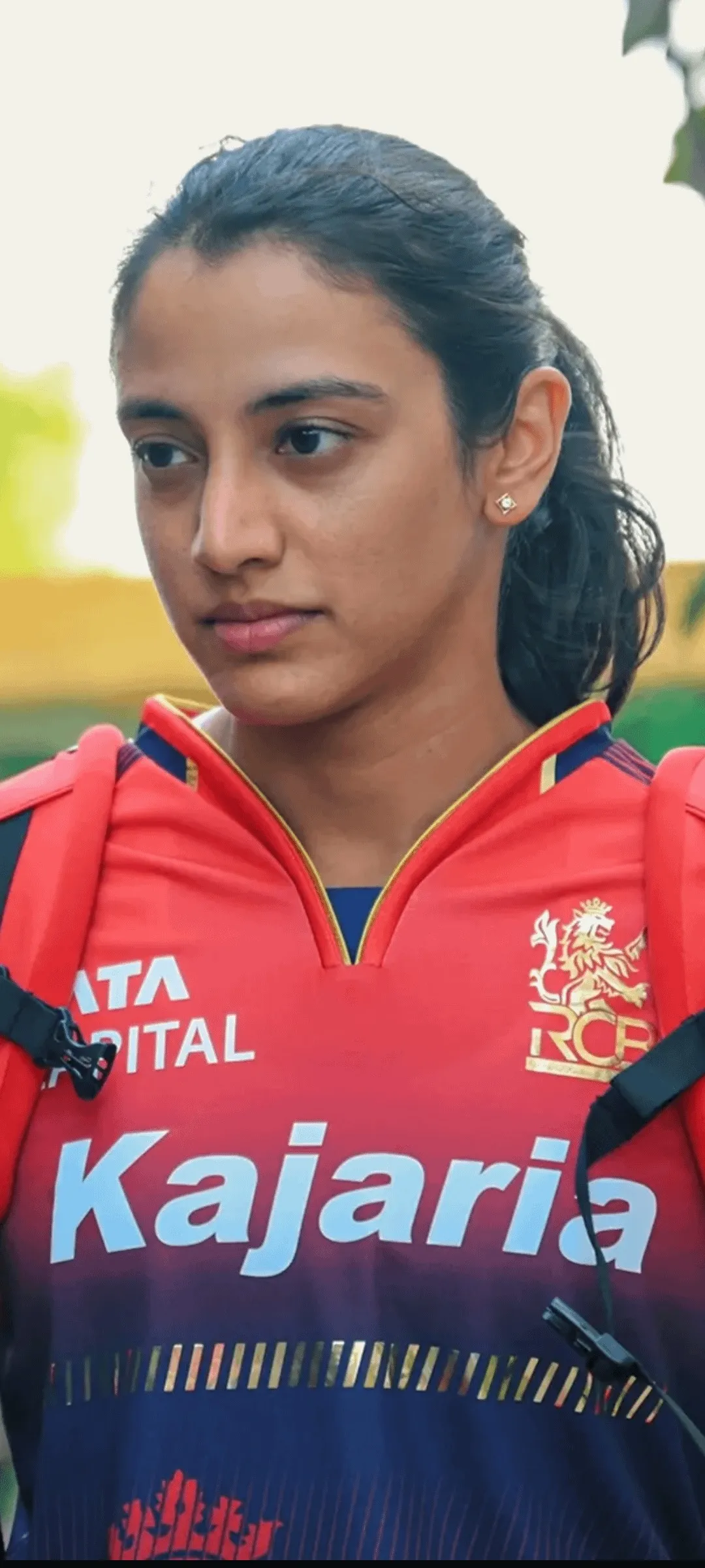 Smriti Mandhana in Kajaria jersey looking focused and serious
