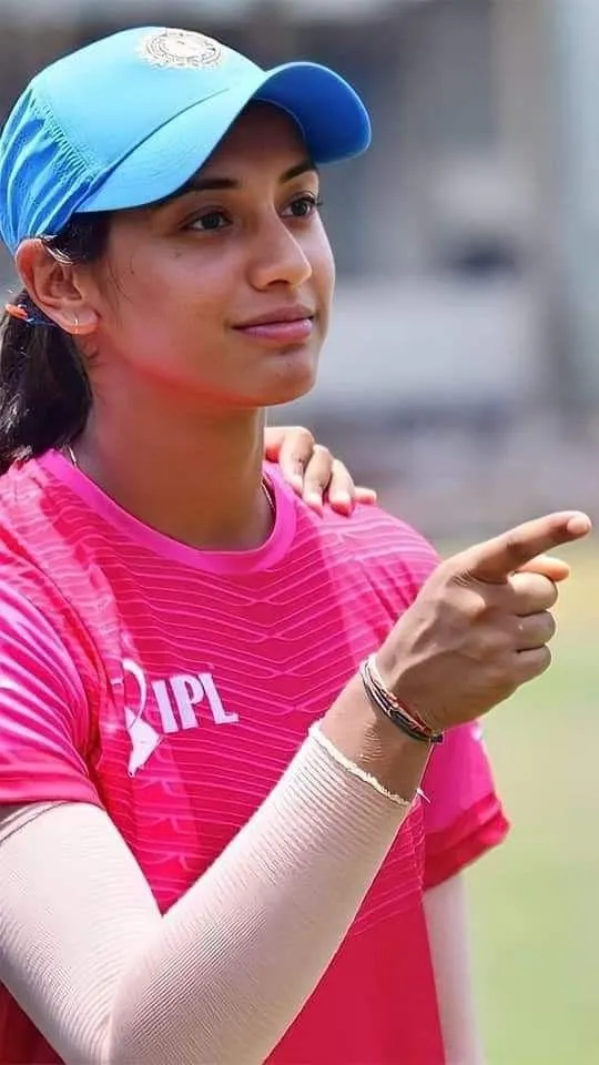 Smriti Mandhana in Pink Jersey Pointing and Smiling