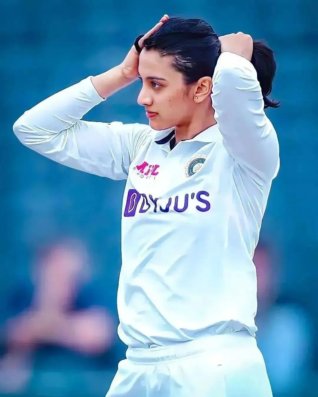 Smriti Mandhana in white jersey during a cricket match