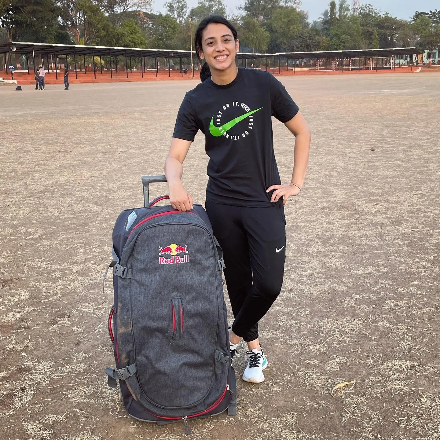 Smriti Mandhana on beach carrying backpack in casual outfit