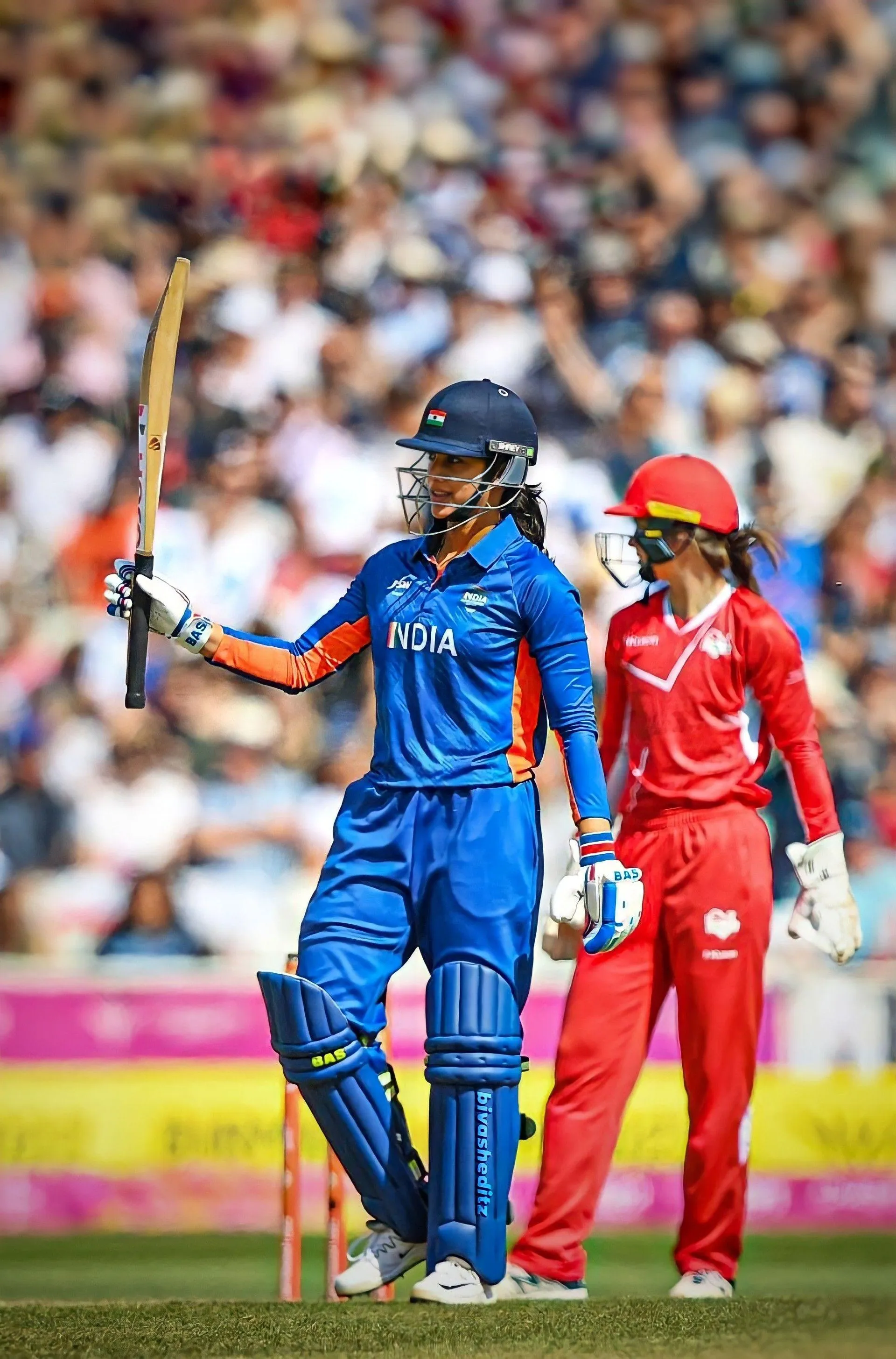 Smriti Mandhana on Field in Red Cricket Jersey wallpaper