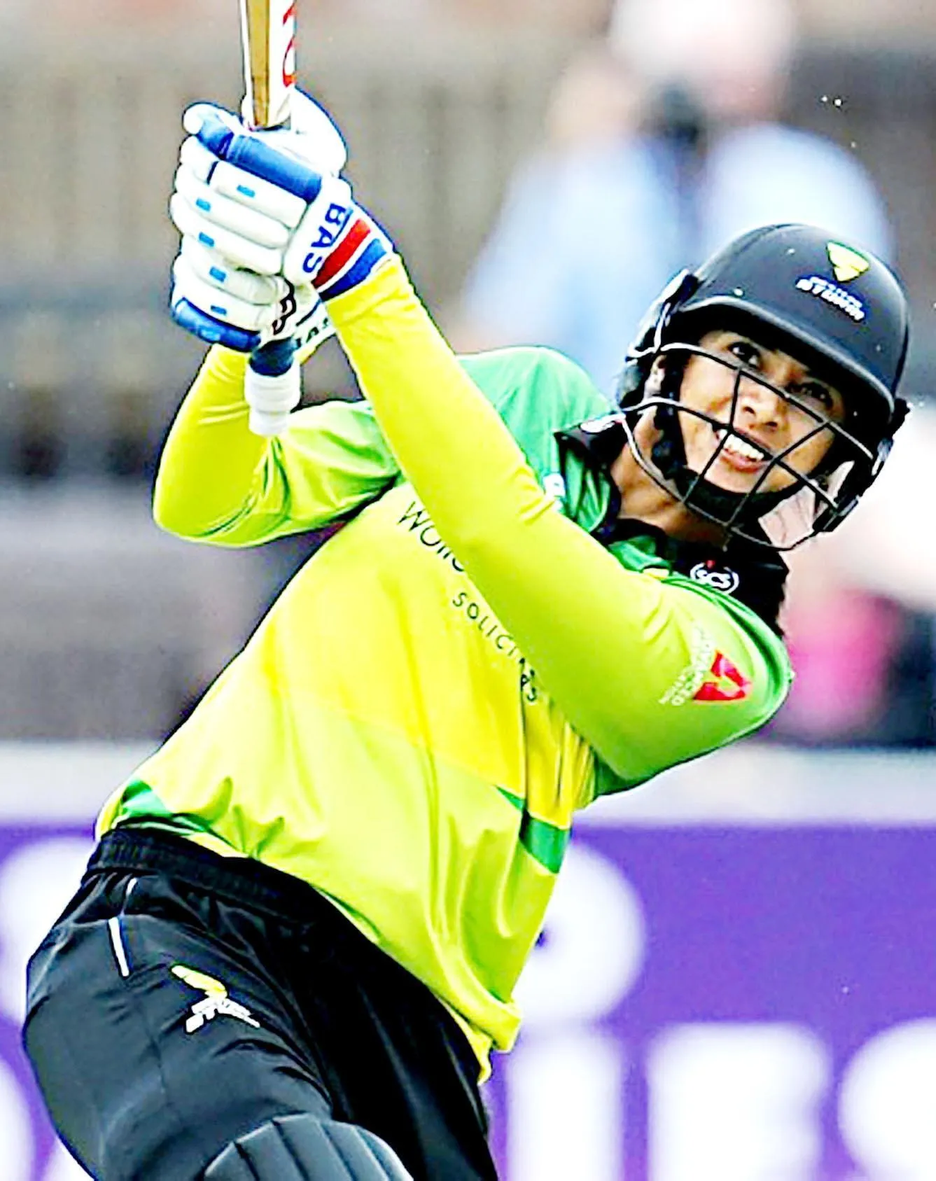 Smriti Mandhana performing in a high energy match wallpaper