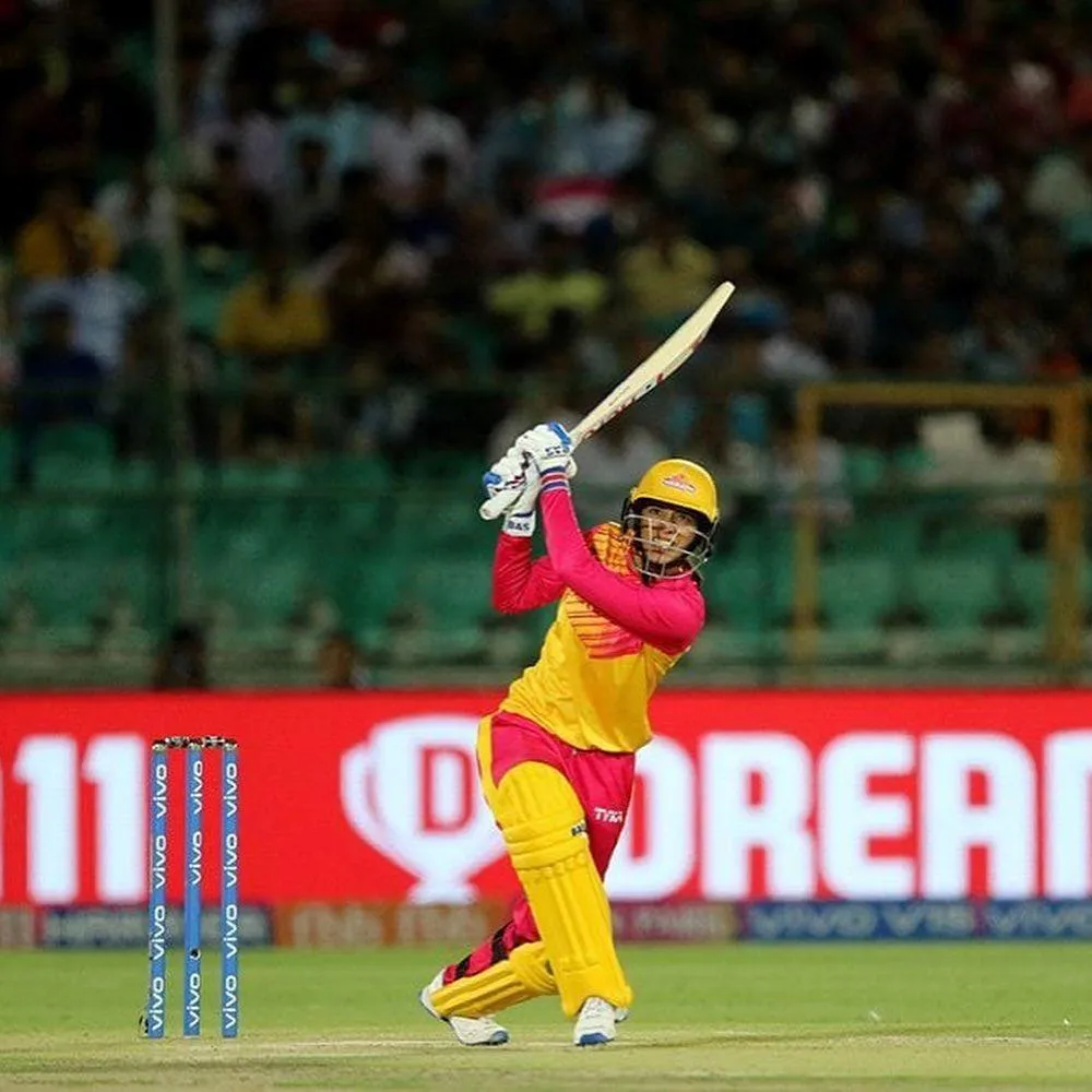 Smriti Mandhana playing a powerful cricket shot during match