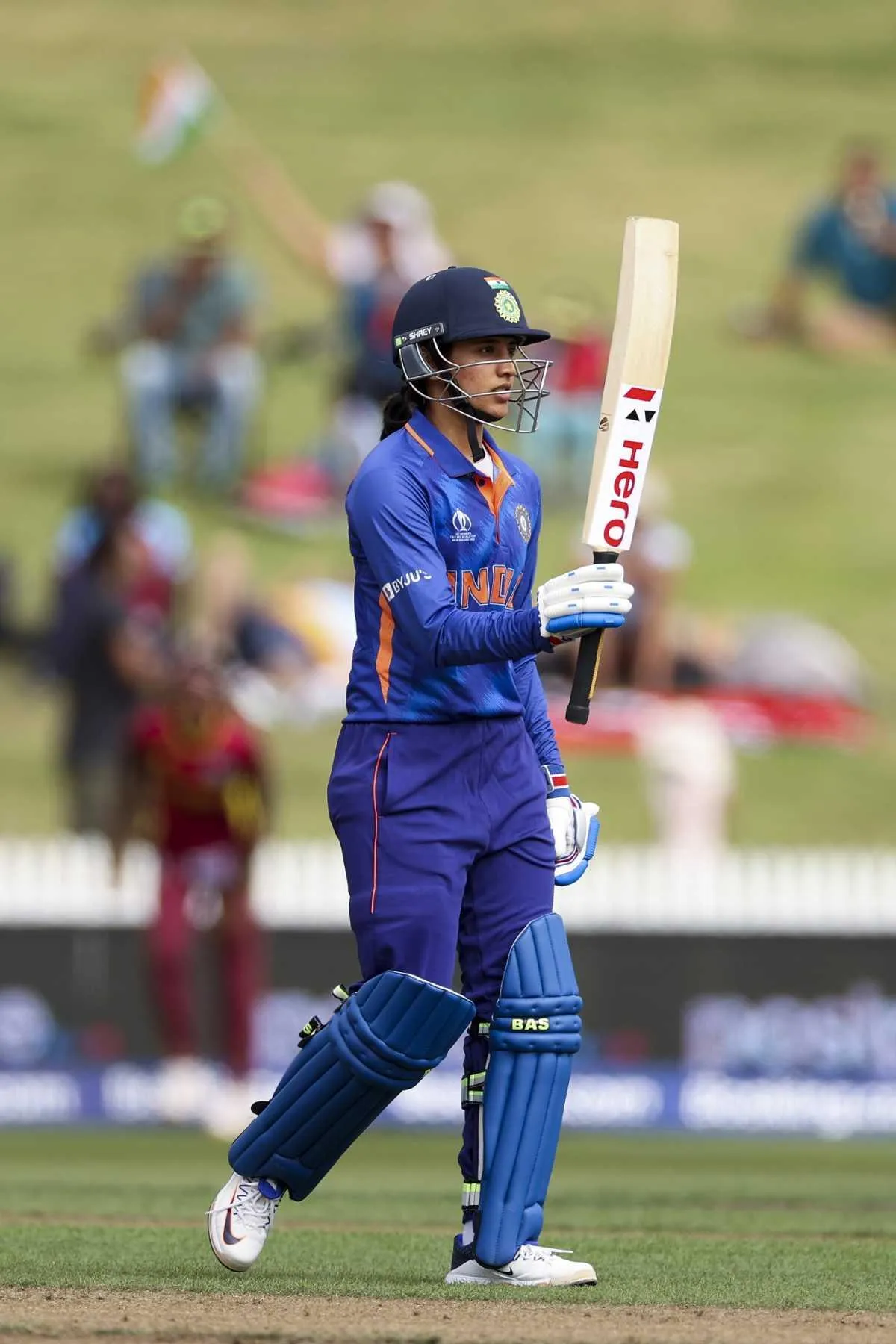 Smriti Mandhana playing a shot during a cricket match
