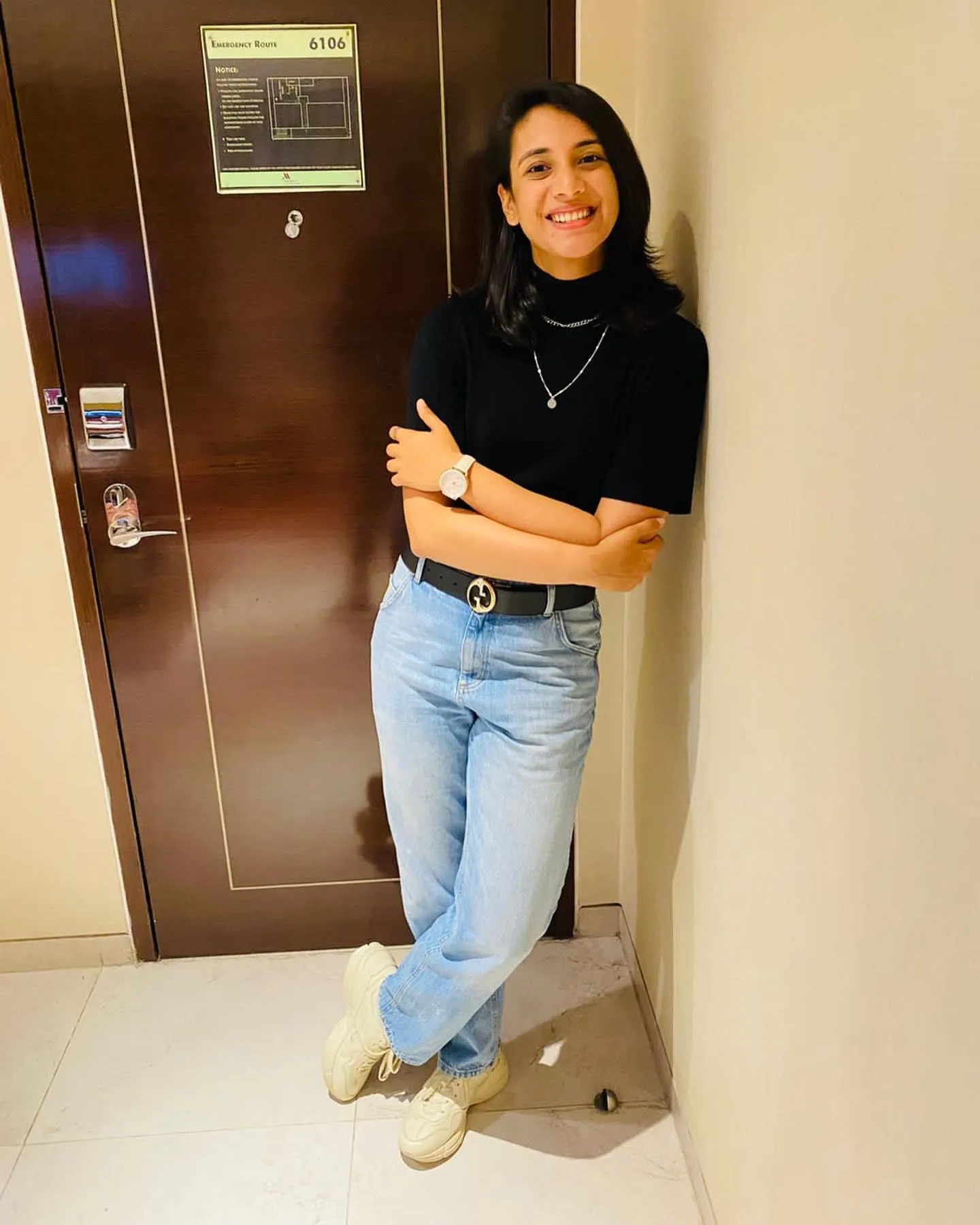 Smriti Mandhana posing casually for a portrait wallpaper