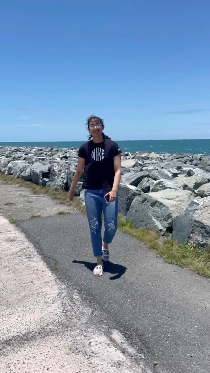 Smriti Mandhana posing for a picture on a mountain trail