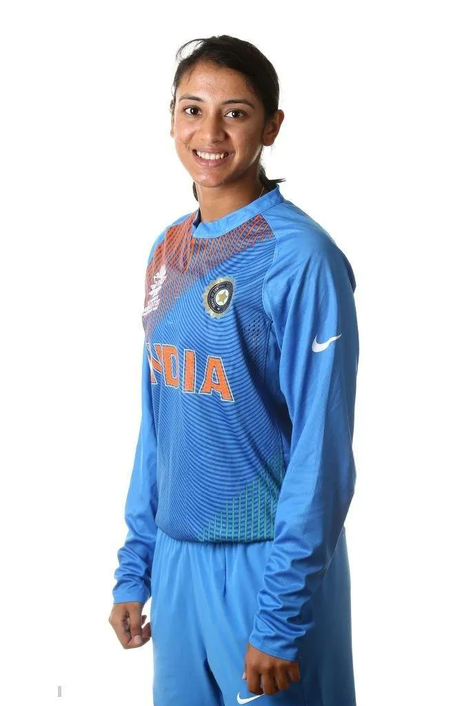 Smriti Mandhana Posing in Blue Jersey with Hands in Pockets