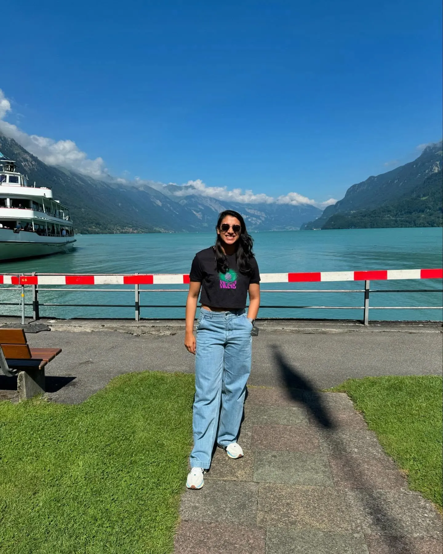 Smriti Mandhana posing in casuals near scenic waterfront