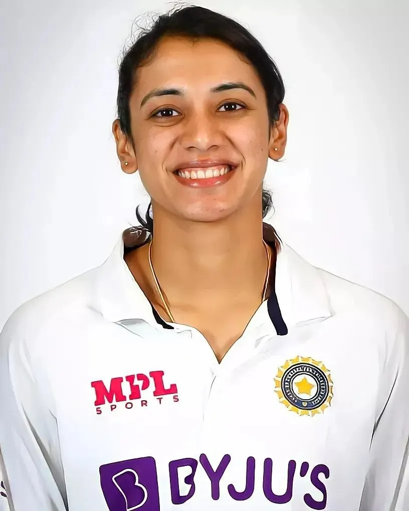 Smriti Mandhana Posing in White Indian Test Jersey wallpaper