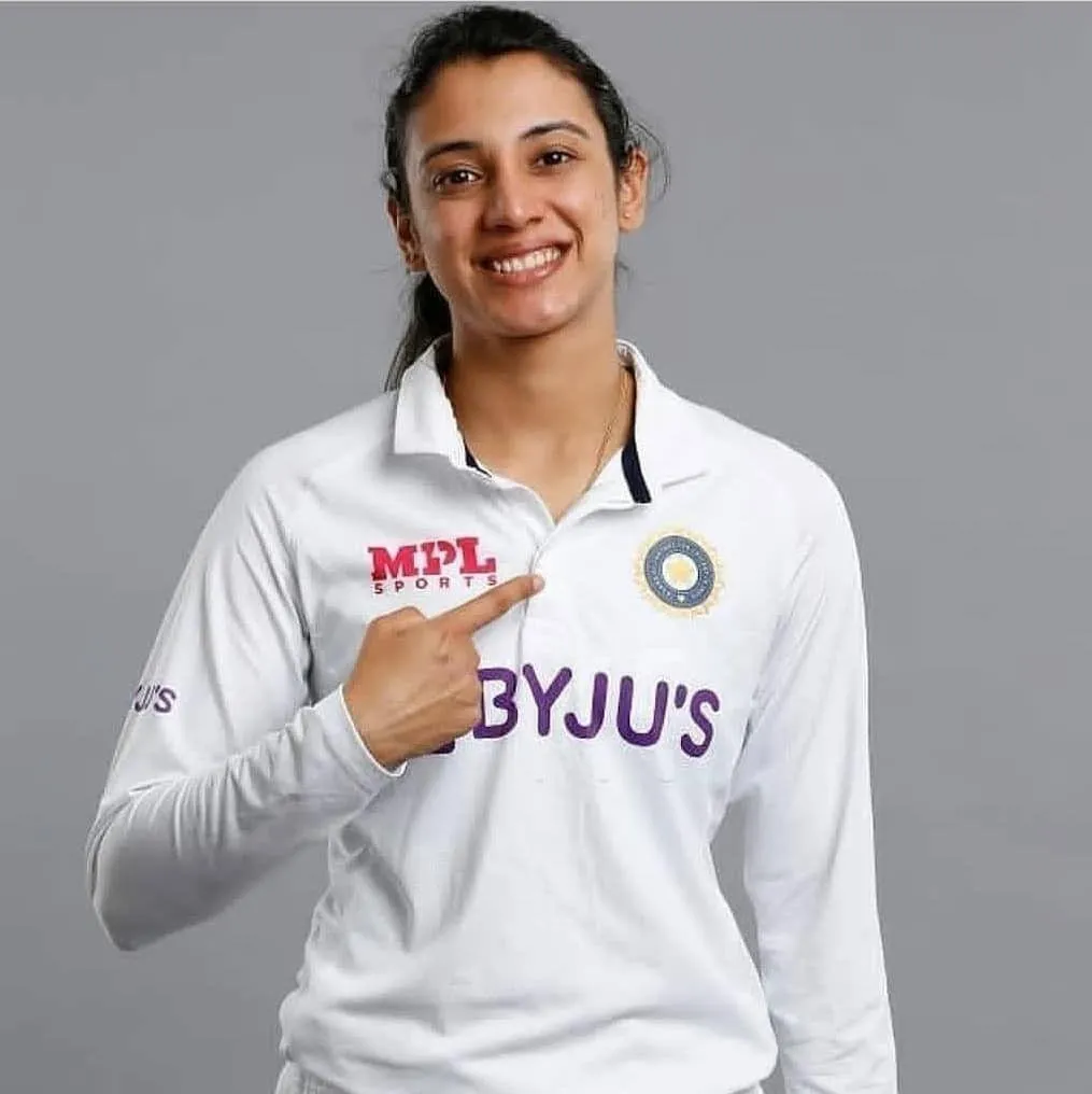 Smriti Mandhana Posing in White Jersey with Proud Expression