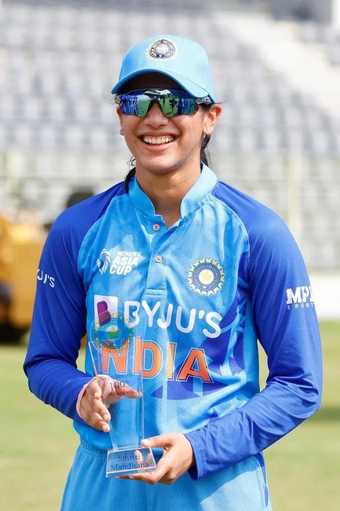 Smriti Mandhana posing on a sunny day with teammates