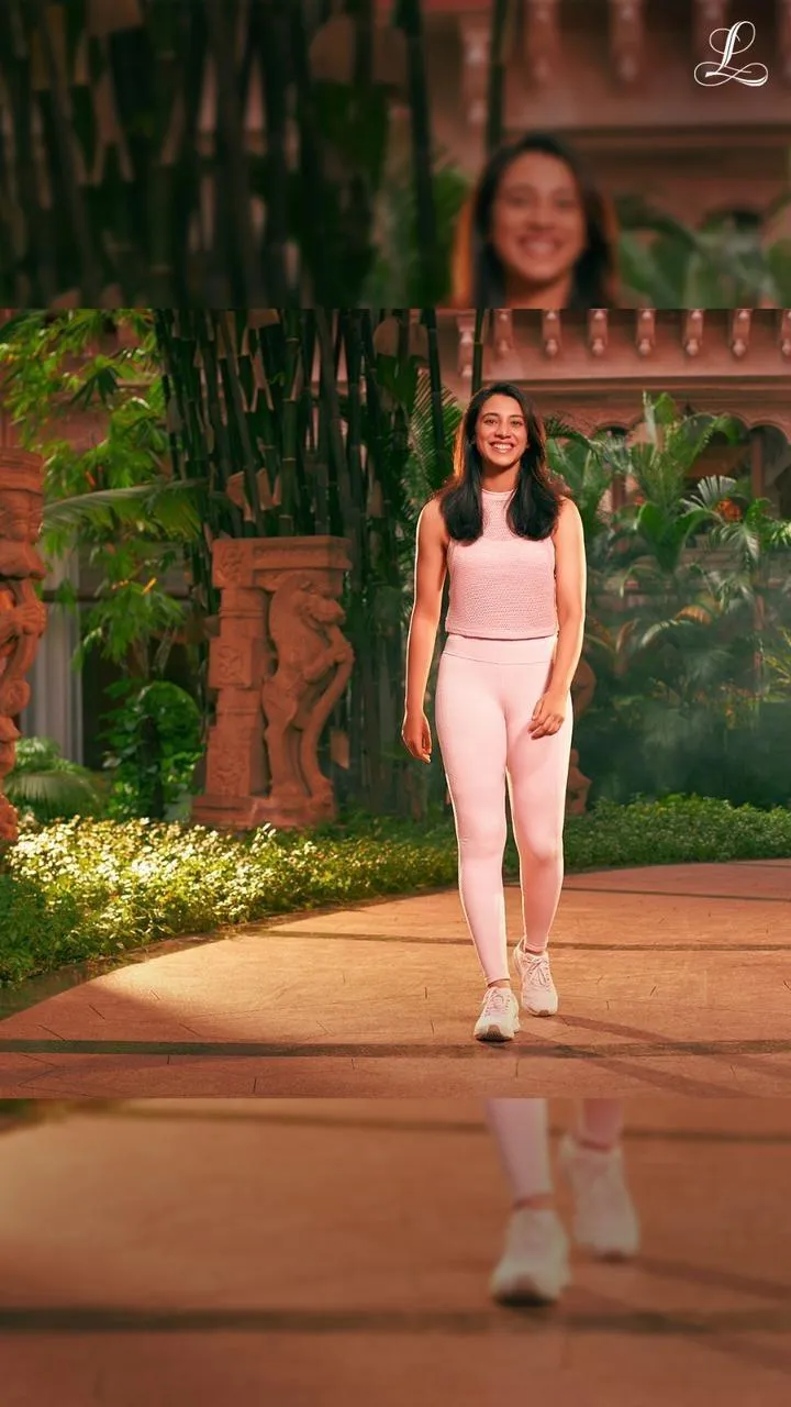 Smriti Mandhana posing outdoors in elegant attire wallpaper