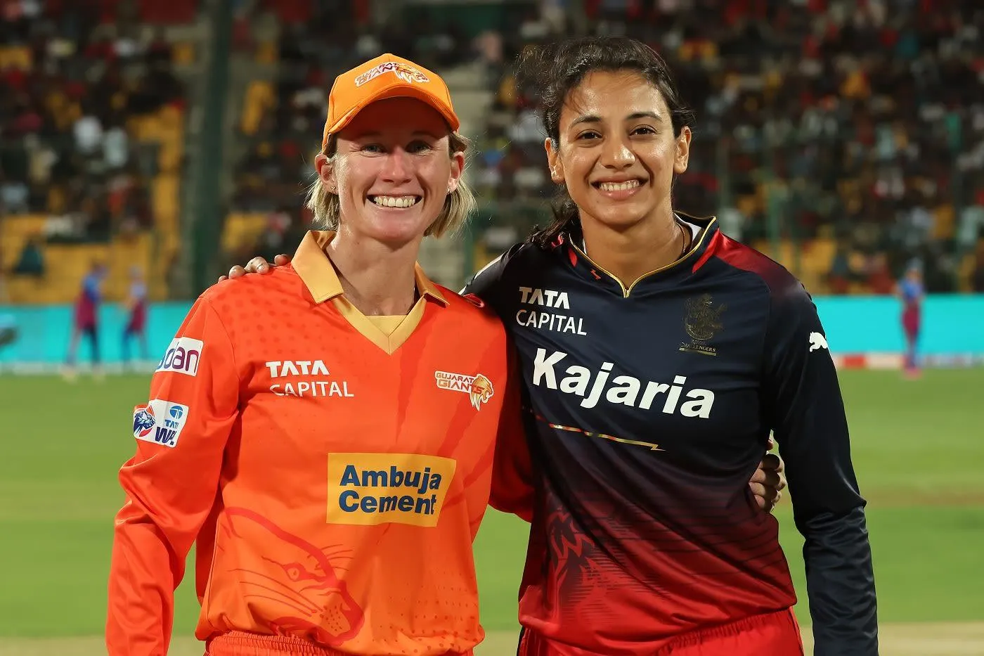 Smriti Mandhana posing with a fellow cricketer off field