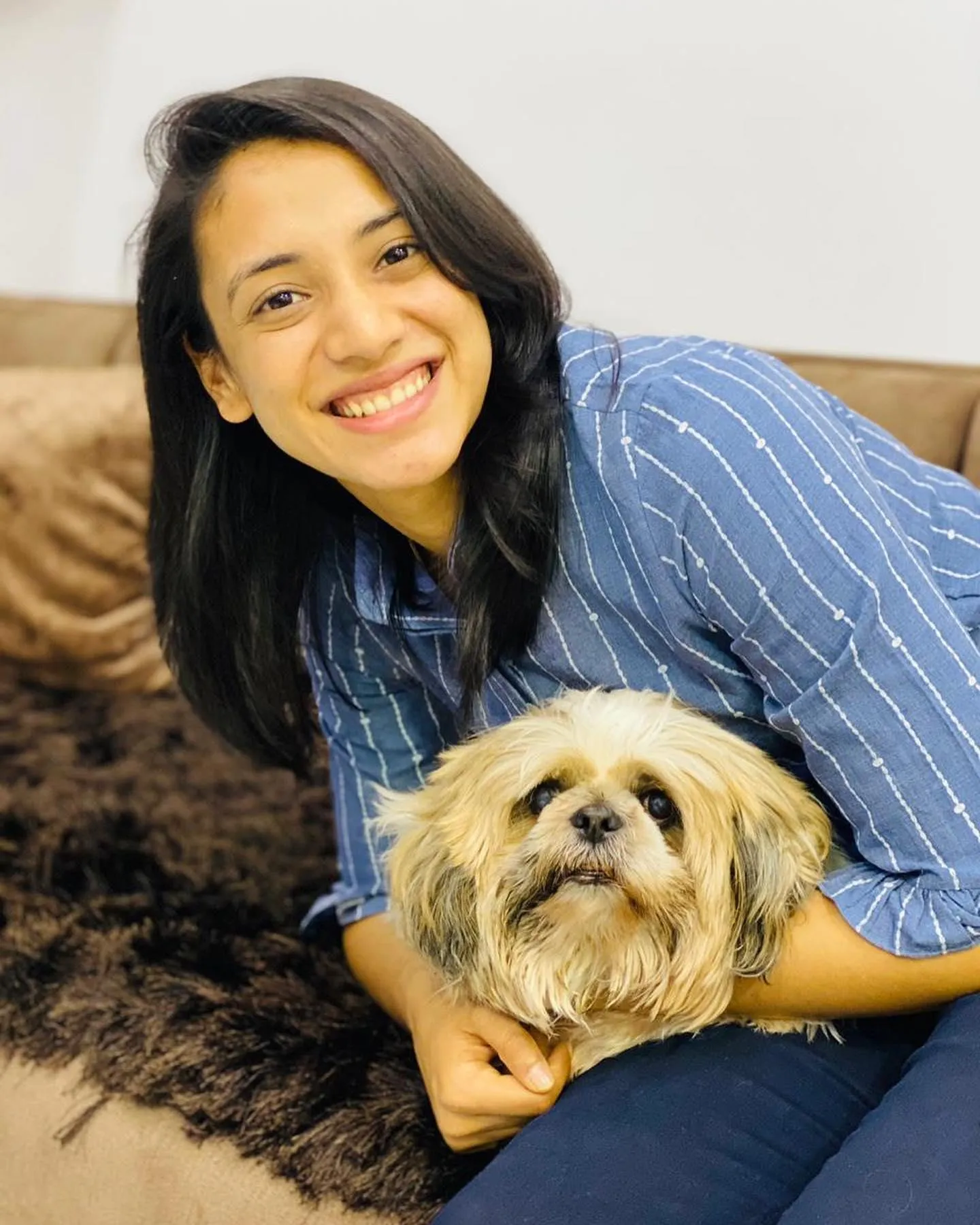 Smriti Mandhana Posing with Her Adorable Dog wallpaper