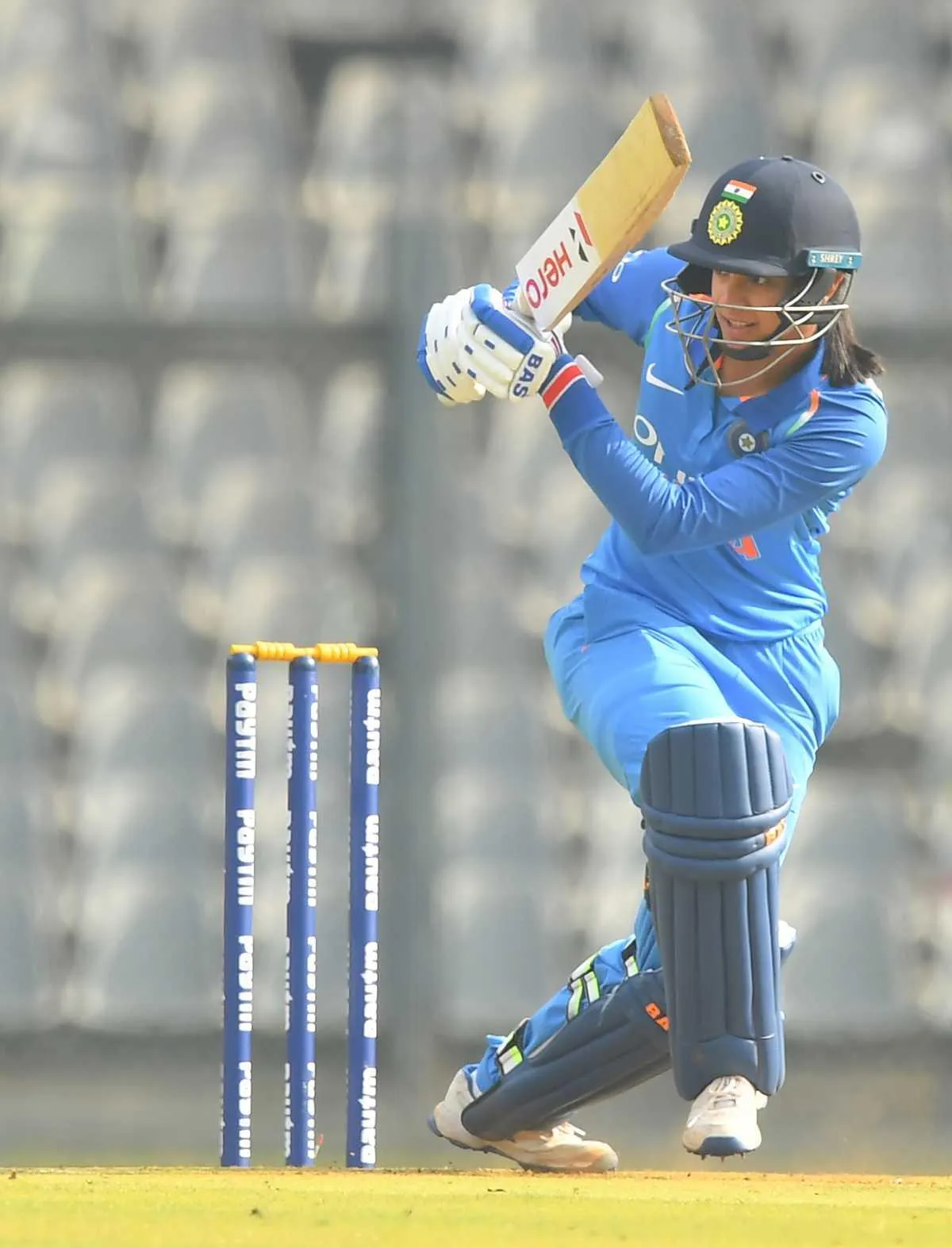 Smriti Mandhana practicing her shots during a cricket game