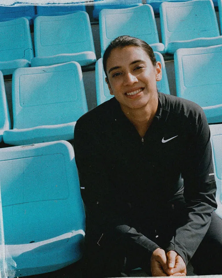 Smriti Mandhana preparing for a cricket shot at the ground