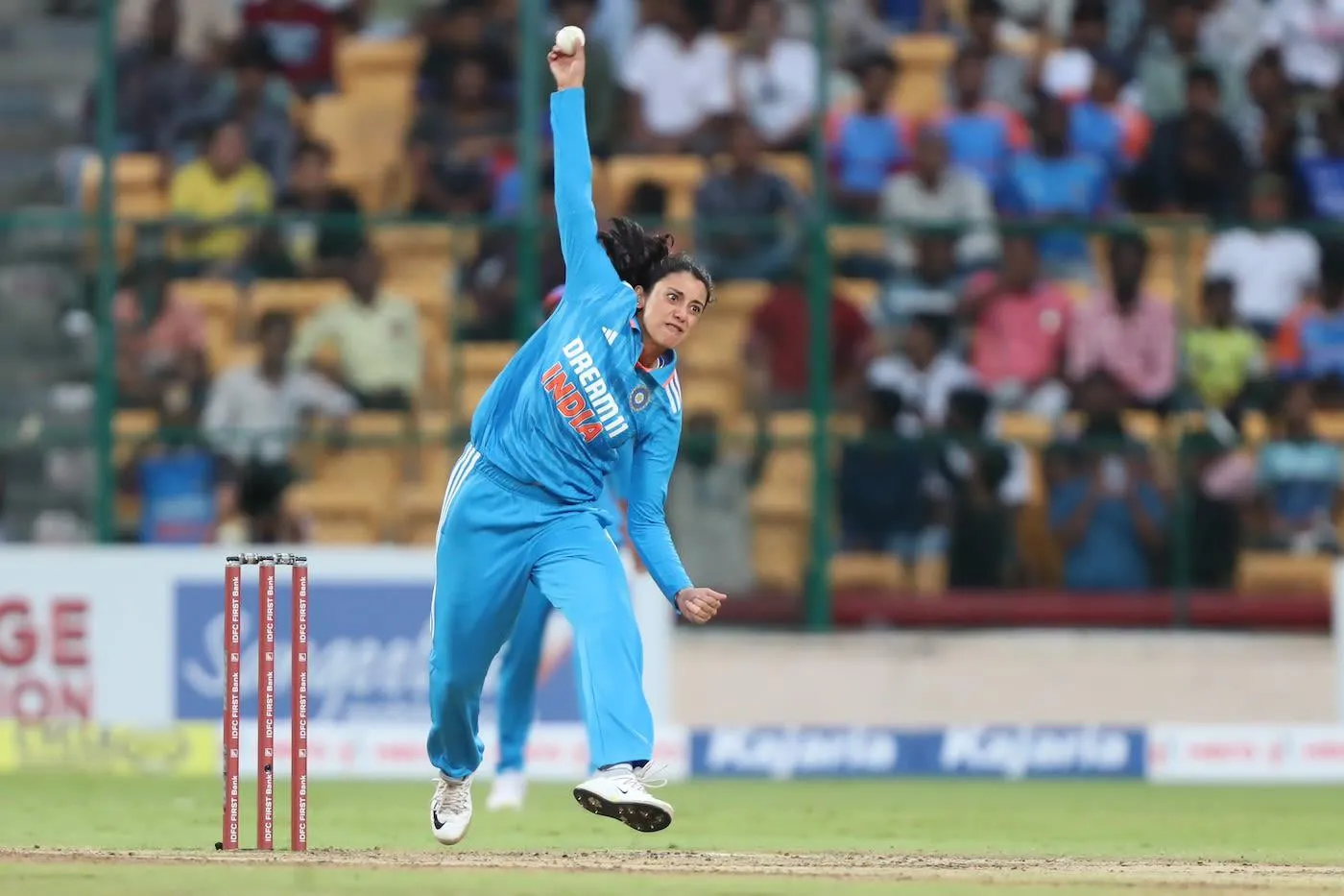 Smriti Mandhana preparing to bat during a professional match