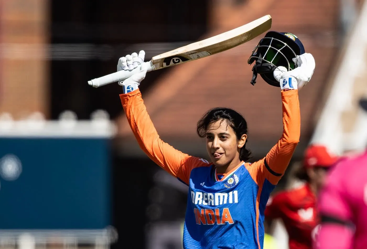 Smriti Mandhana raising bat after scoring runs for her team