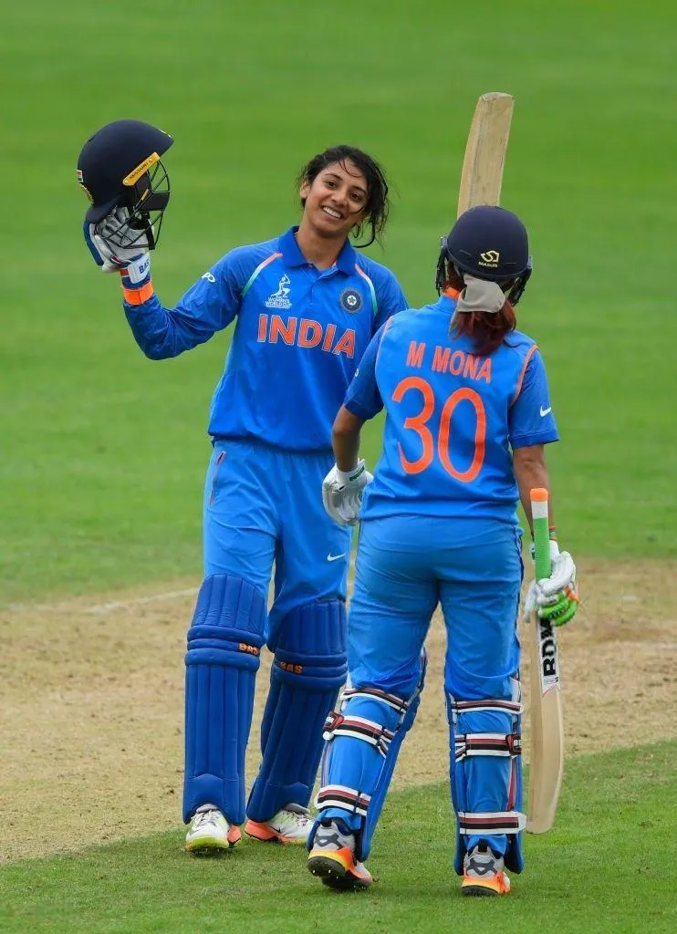 Smriti Mandhana sharing a joyful moment with teammates