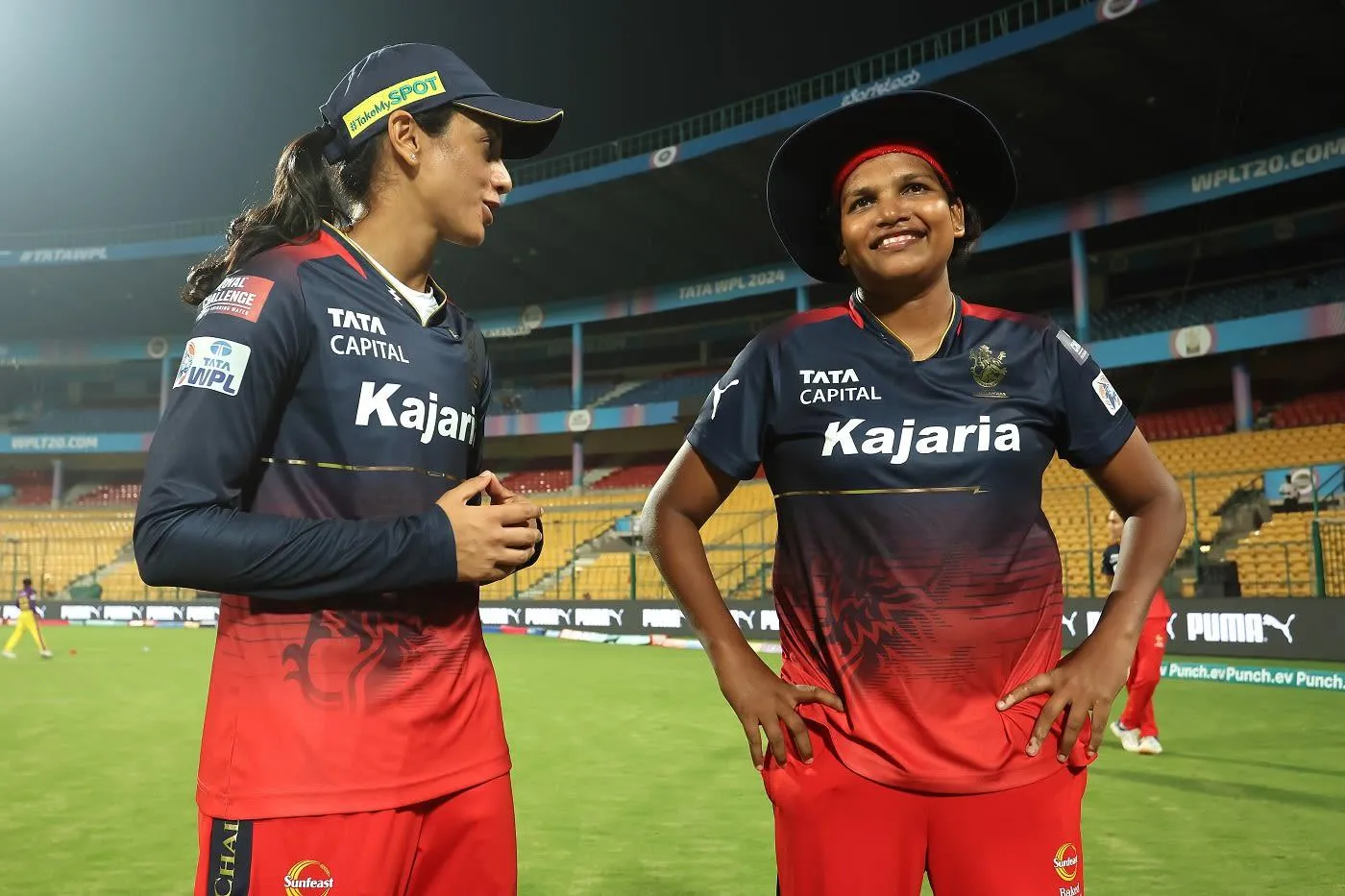 Smriti Mandhana sharing a laugh with fellow cricketer