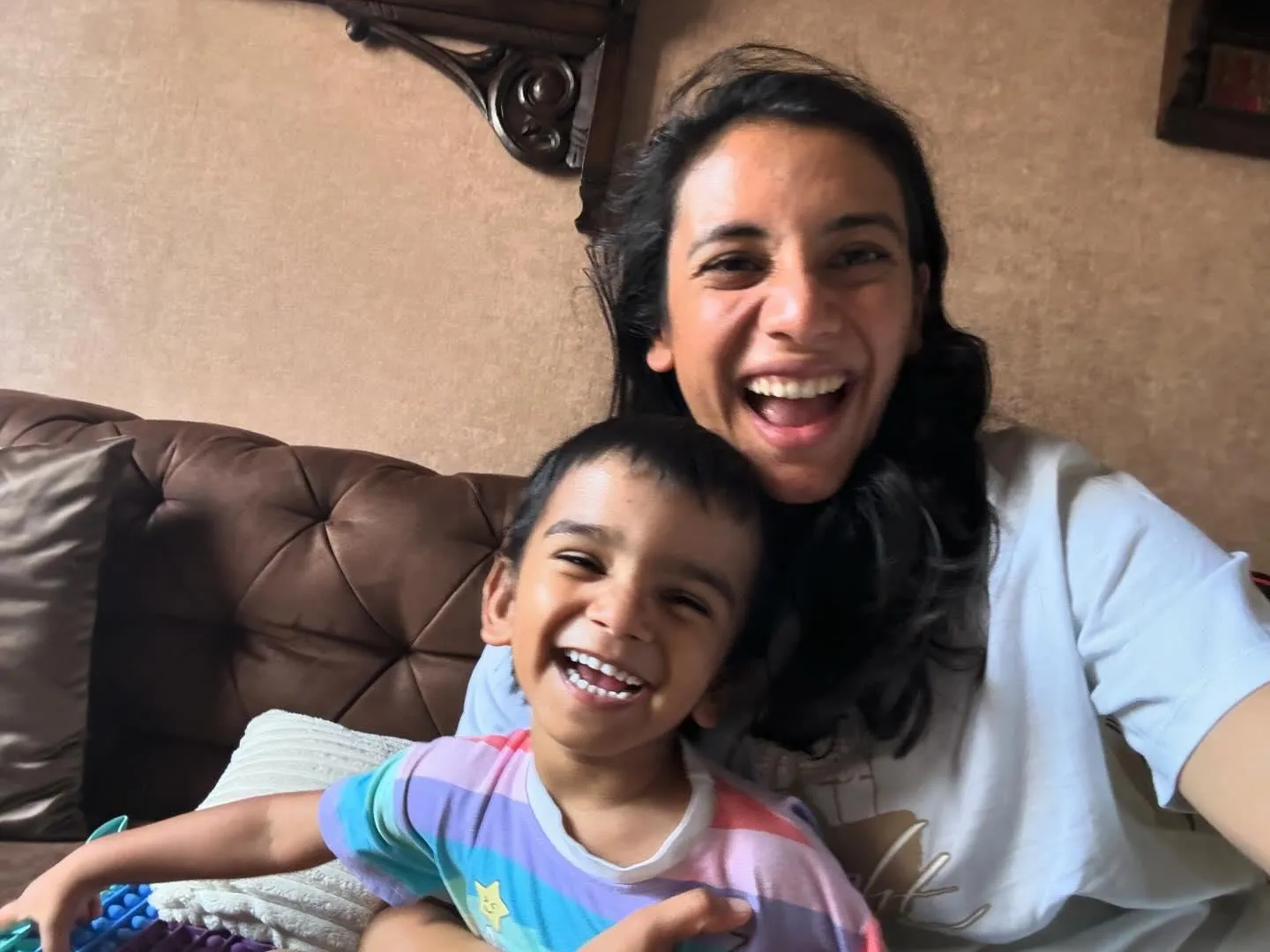 Smriti Mandhana sharing a light moment with a child