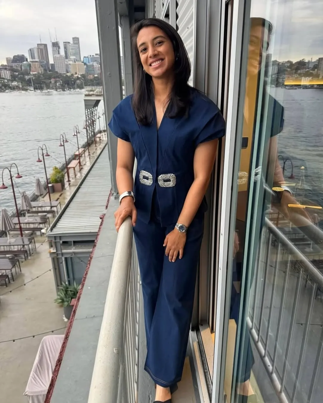 Smriti Mandhana showcasing her skills in a match wallpaper