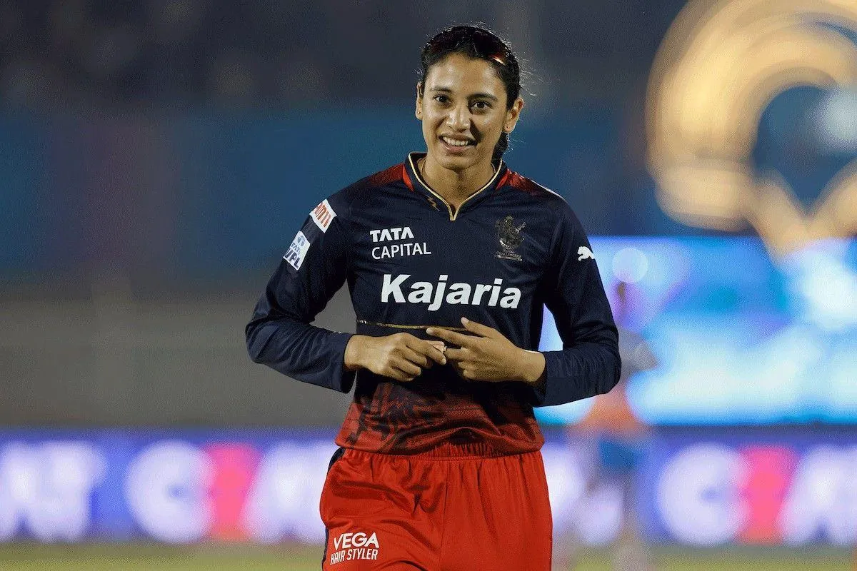 Smriti Mandhana showing cricket skills in action wallpaper