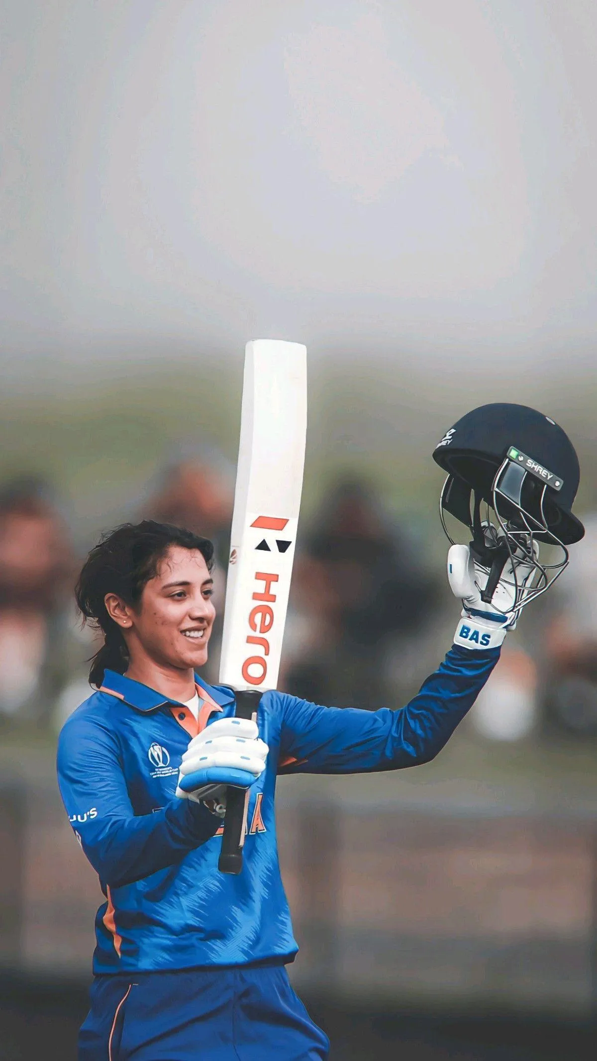 Smriti Mandhana showing energy with cricket gear wallpaper