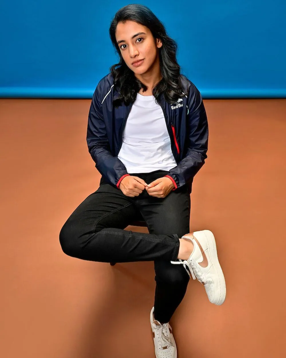 Smriti Mandhana Sitting and Smiling in Casual Wear