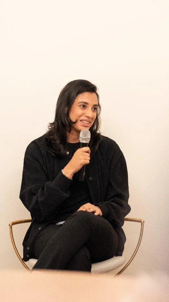 Smriti Mandhana Sitting in Black Dress with Thoughtful Look