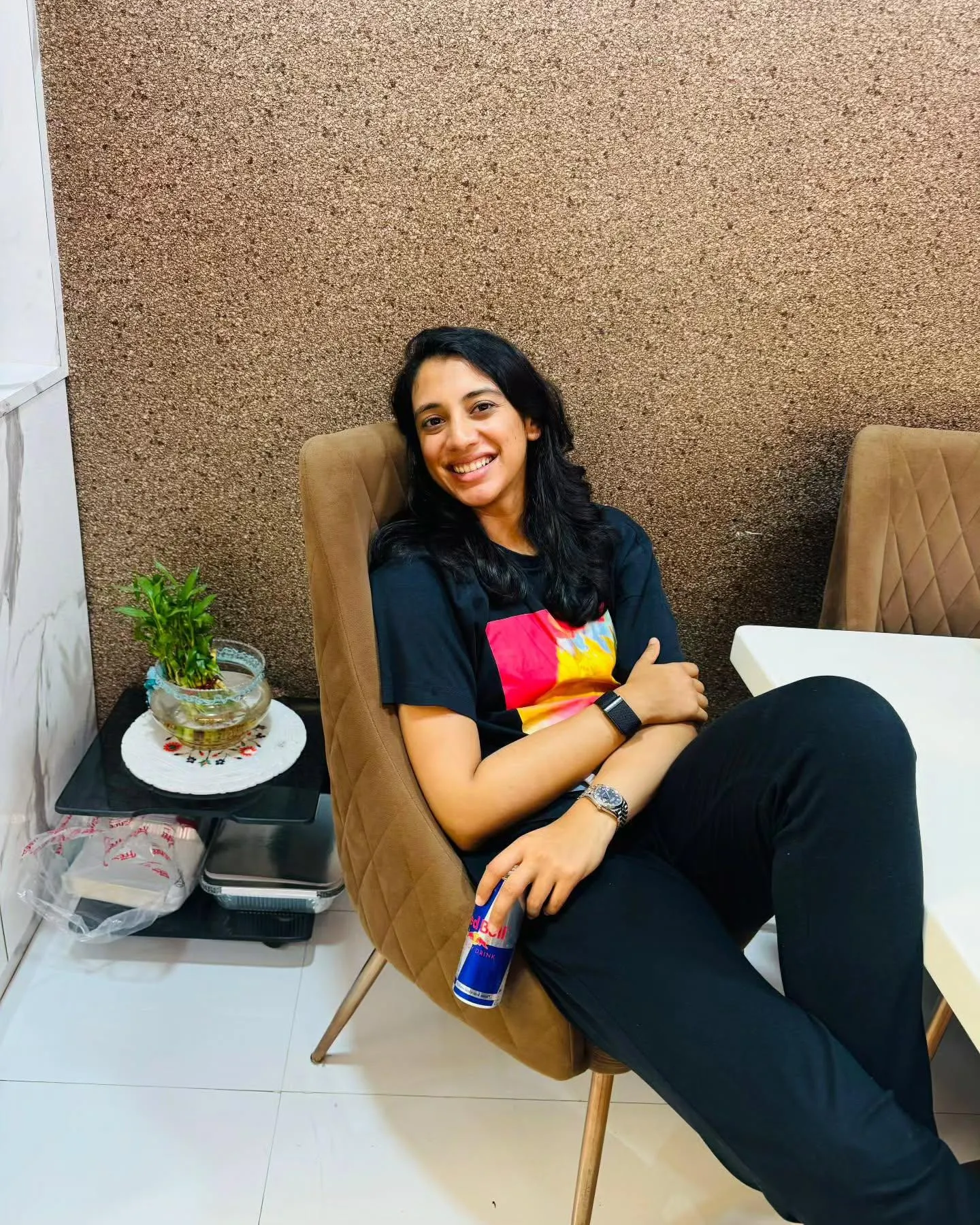 Smriti Mandhana Sitting Indoors with Backpack wallpaper