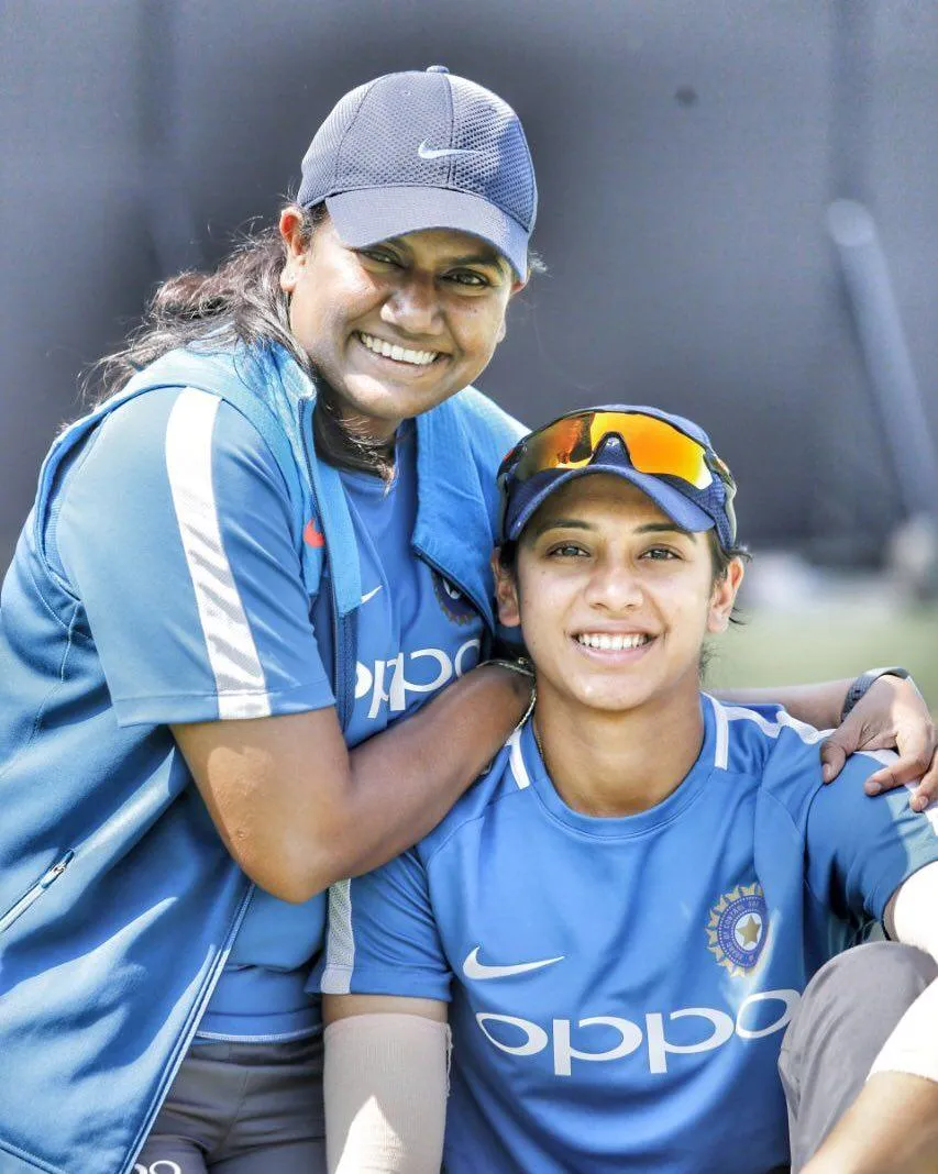 Smriti Mandhana sitting on the field during practice