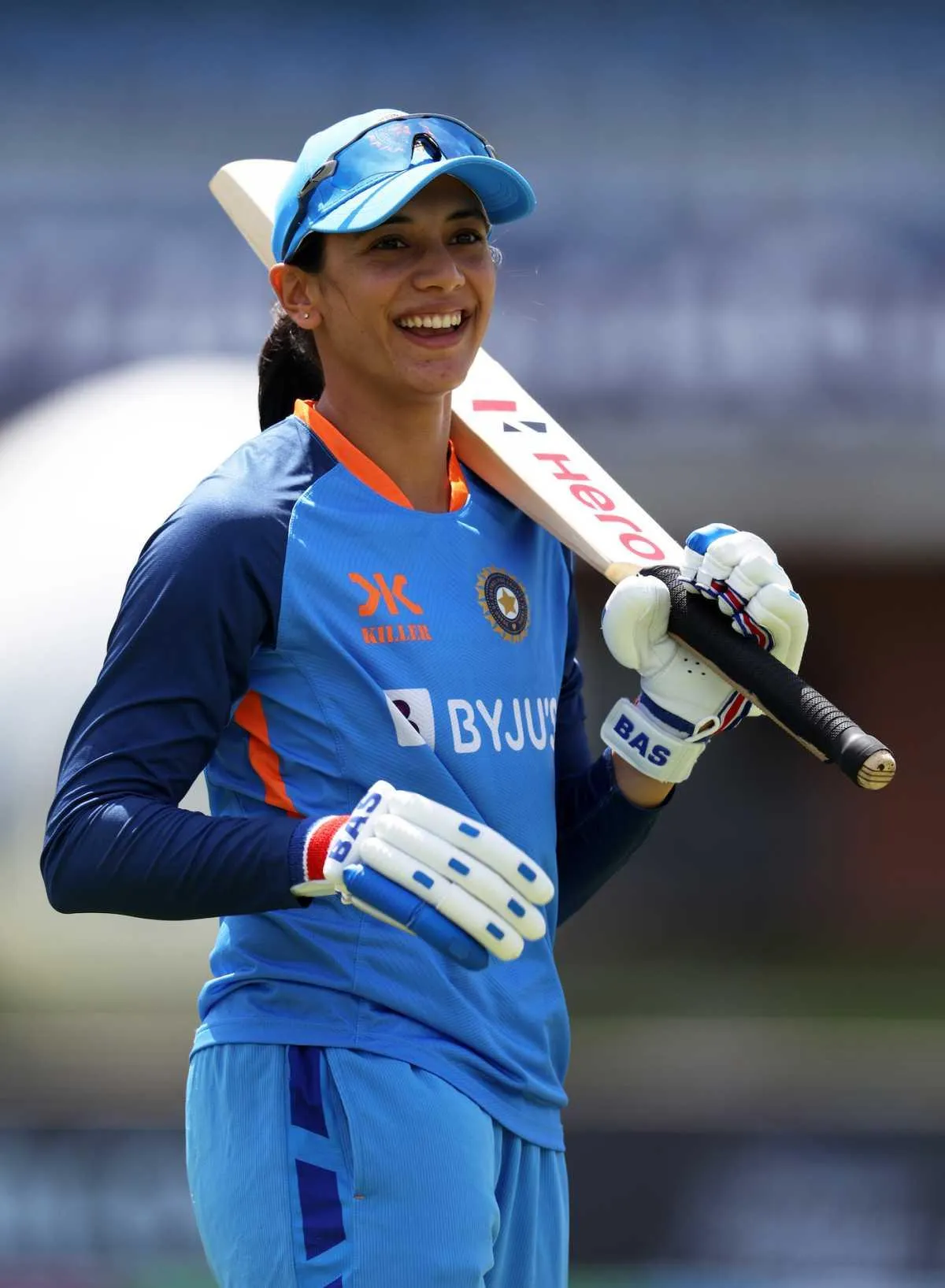 Smriti Mandhana smiling confidently for the camera