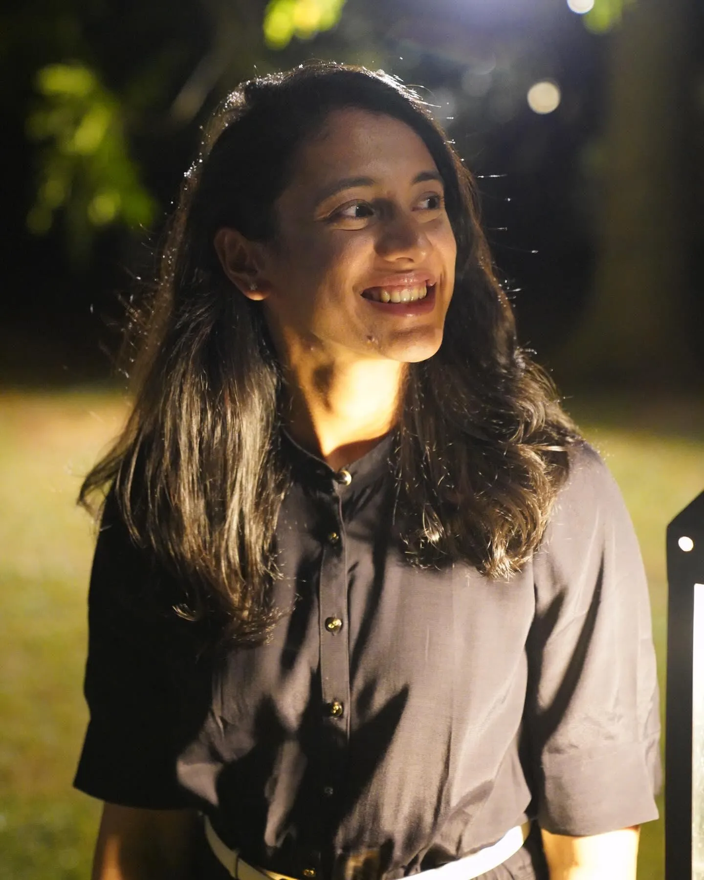 Smriti Mandhana smiling confidently on and off the field
