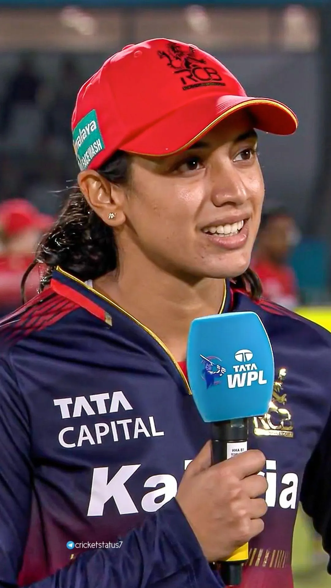 Smriti Mandhana smiling with the team after victory