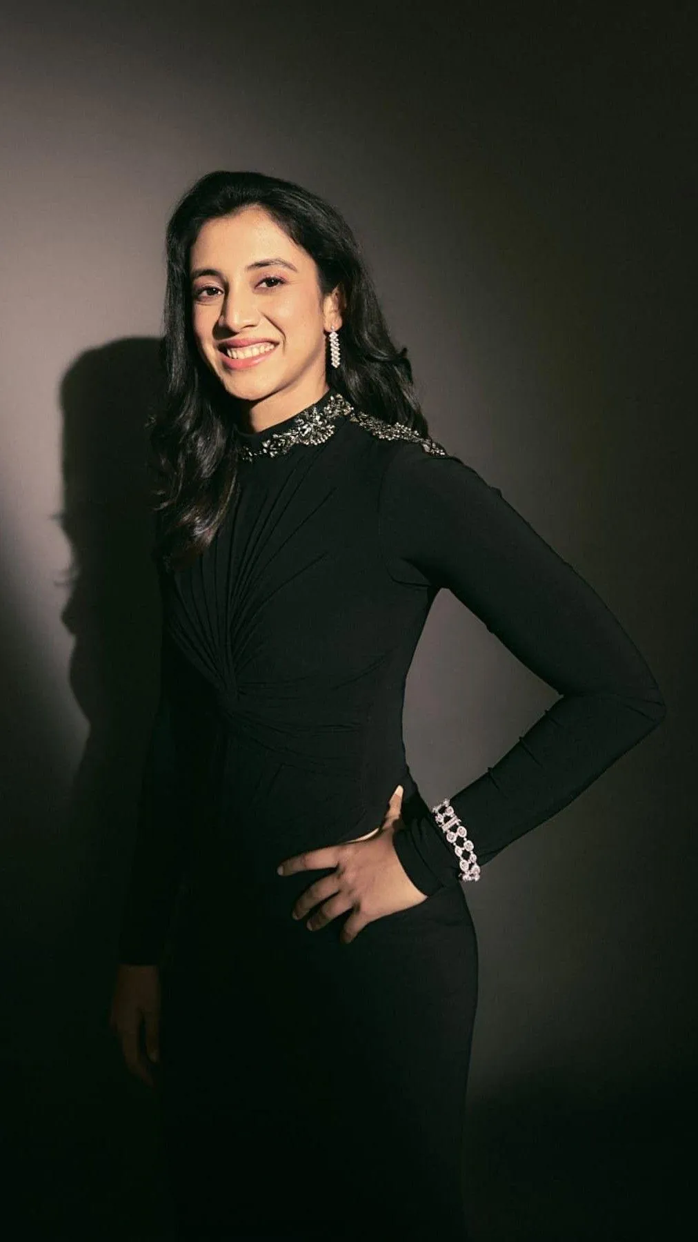 Smriti Mandhana Standing and Smiling in Black Dress