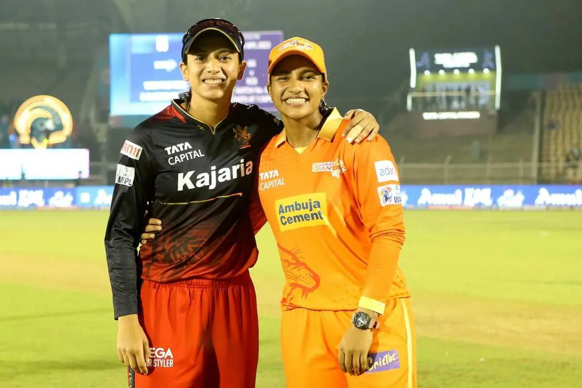 Smriti Mandhana Standing with Orange Team Player wallpaper