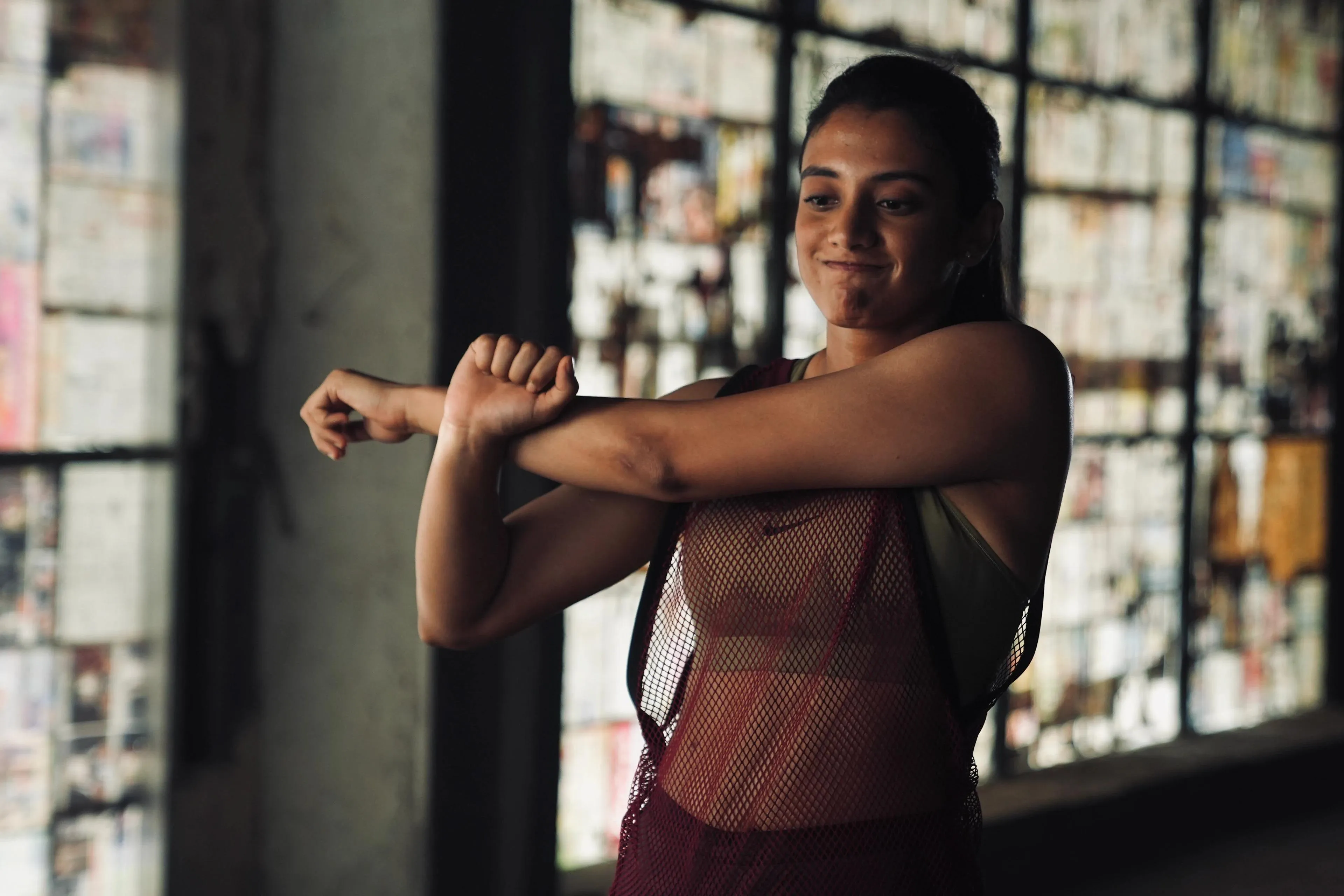 Smriti Mandhana Stretching Indoors Before Workout wallpaper